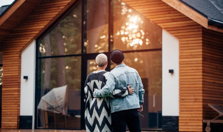 Young Couple Looking at Cool House